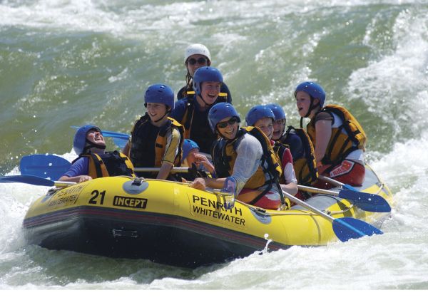 Group enjoying a day of whitewater rafting at Penrith Whitewater Stadium