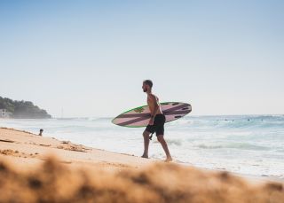 Man enjoying the surf at North Narrabeen Beach, North Narrabeen