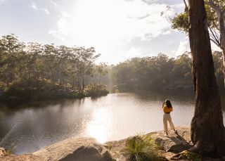 Woman enjoying a walk along the banks of the Parramatta River, Parramatta