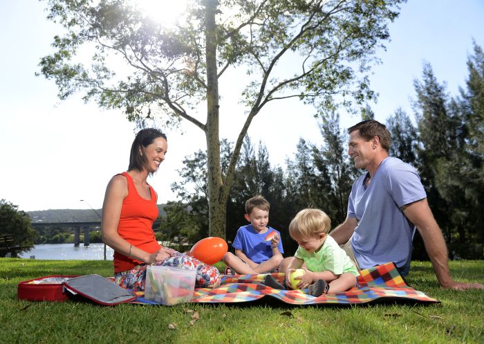 A family enjoys a picnic on the Nepean river, Penrith