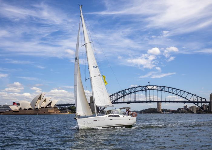 People enjoying a chartered sailing tour on Sydney Harbour