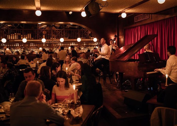 Patrons listening to live jazz at Restaurant Hubert