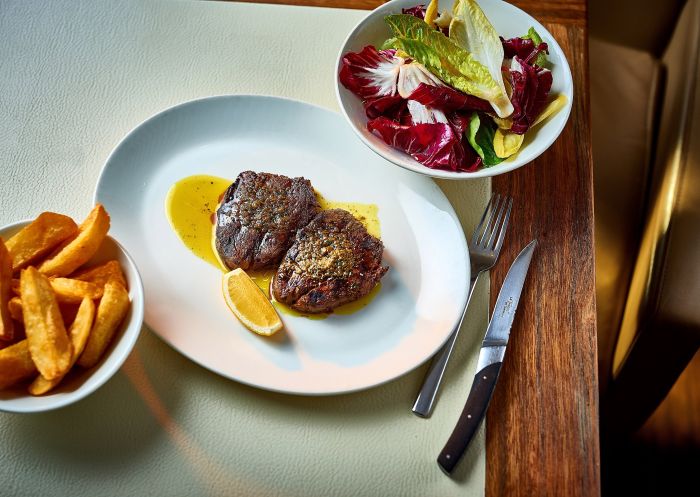 Steak, chips and salad at Rockpool Bar and Grill in City Centre