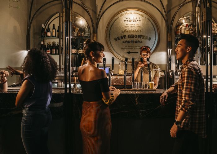 Couple ordering beers at Endeavour Tap Rooms in The Rocks, Sydney City