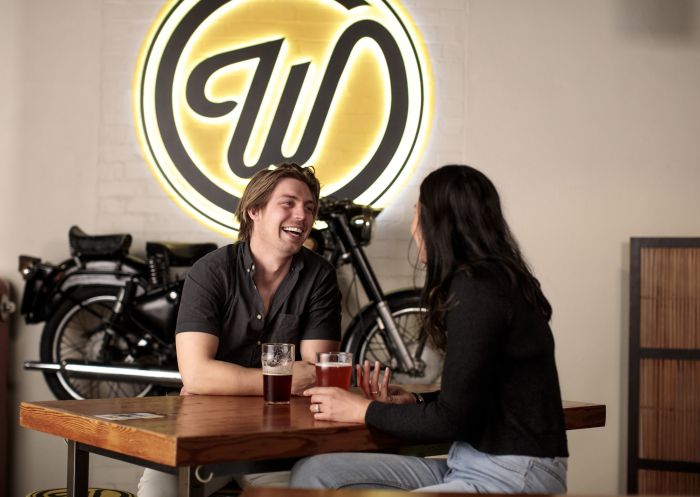 Couple enjoying beers at Wayward Brewing Co., Camperdown,