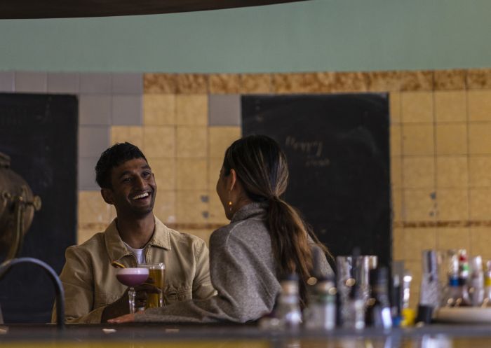 Couple enjoying a drink at The Old Clare Hotel, Chippendale