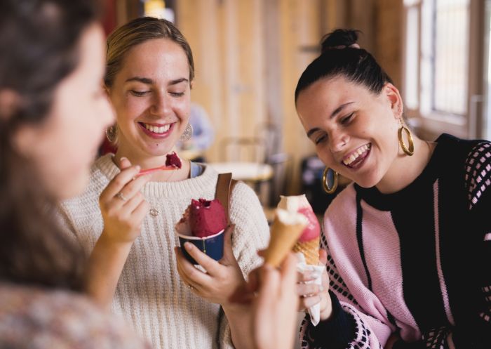 Friends enjoying ice-creams at Cow & The Moon on Enmore Road in Enmore, Inner Sydney