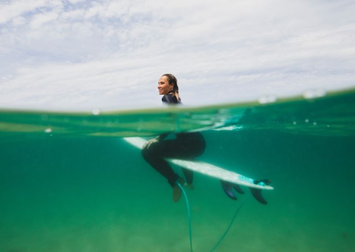 Surfer in the waters off North Narrabeen Beach, North Narrabeen