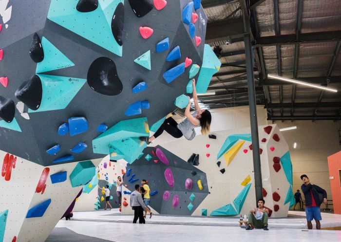  Climber on an overhung wall at BlocHaus Bouldering, Marrickville