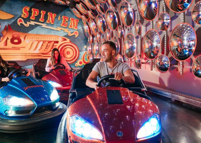 Friends on bumper cars at Archie Brothers Cirque Electriq, Alexandria