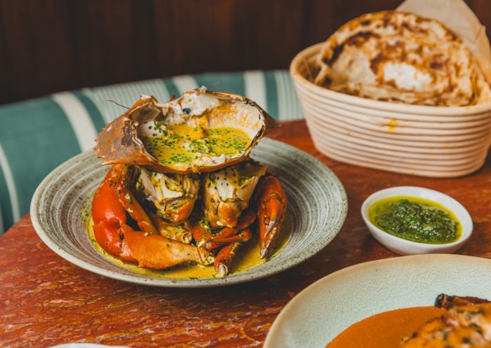 Mud crab with garlic pepper butter and paratha at Raja, Potts Point 