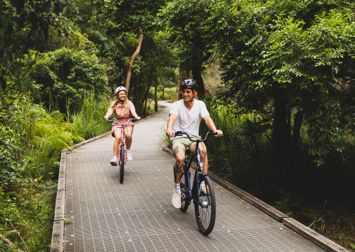 Couple enjoying a day of cycling on the Narrabeen Lagoon Trail, Narrabeen