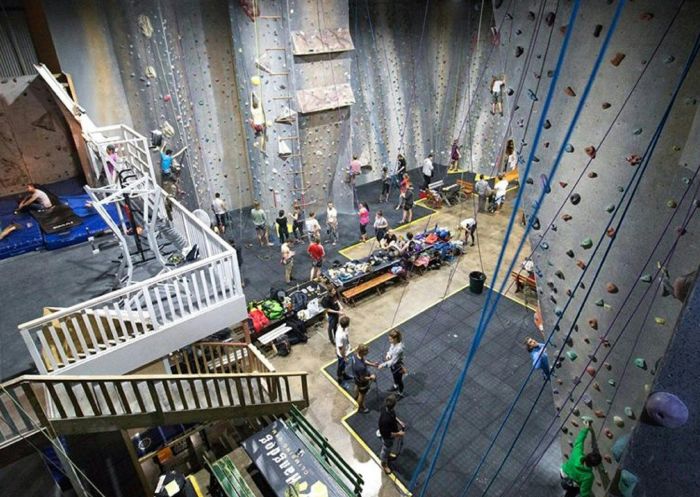 People enjoying climbing wall at Hangdog Climbing Gym, Wollongong