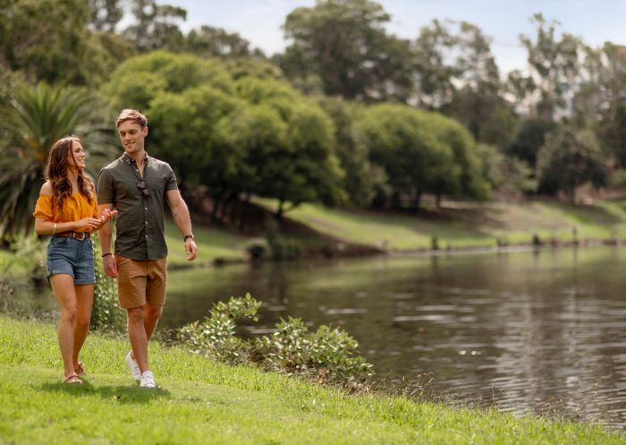 Couple enjoying a walk through Parramatta Park, Parramatta