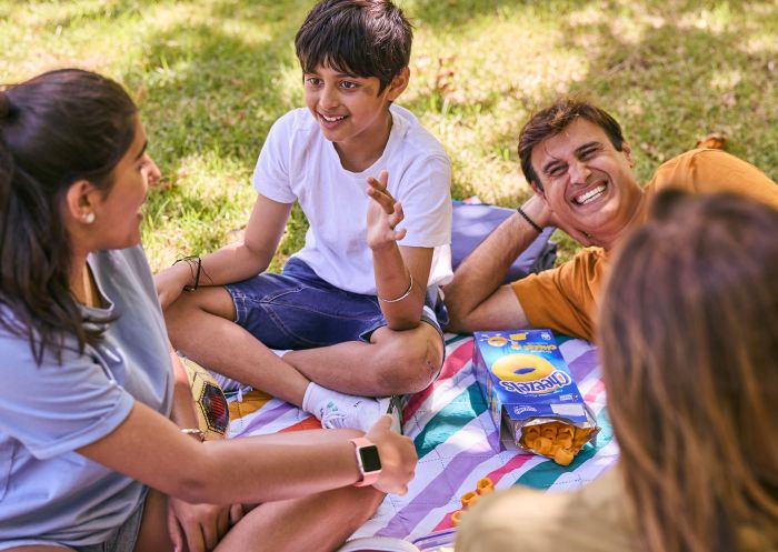 Family enjoying picnic at Bicentennial Park, Sydney Olympic Park
