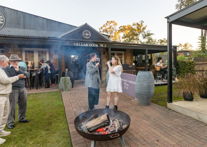 Friends enjoying wine tastings with Gourmet Getaway Tours at Saddlers Creek Winery, Pokolbin