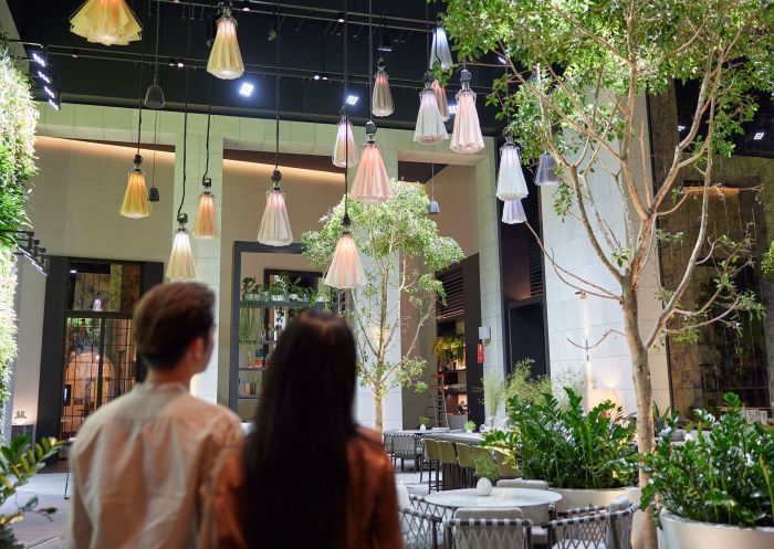 Young couple in the lobby admiring the impressive entrance hall at Capella, Sydney