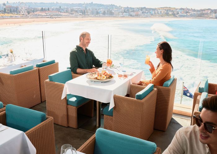 People enjoying the view at Icebergs Dining Room and Bar, Bondi