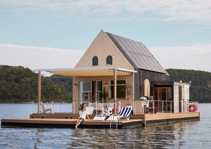 Couple lounging on the dock at Lilypad, Palm Beach