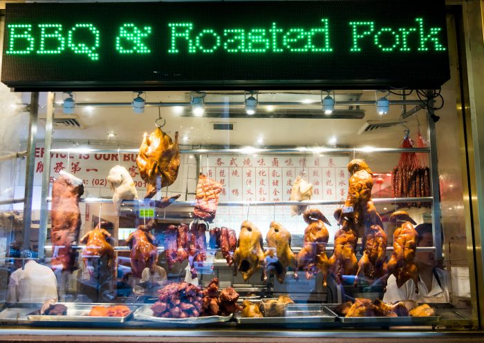 BBQ and roasted duck hanging in a restaurant window in Chinatown