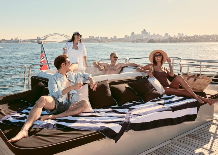 Friends enjoying drinks and a spa onboard Ghost 2 Super Yacht, Sydney Harbour