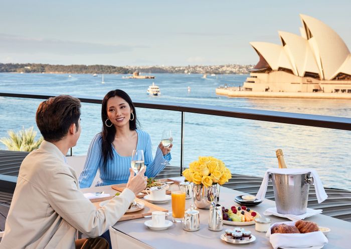 Couple having an outdoor breakfast at Park Hyatt, The Rocks