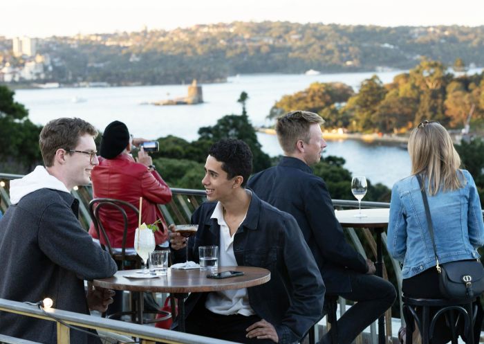 People enjoying the rooftop bar at the The Library Bar at The State Library, Sydney