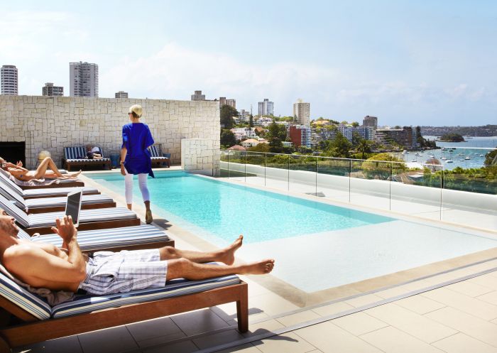 People relaxing by the pool at the Intercontinental Hotel, Double Bay