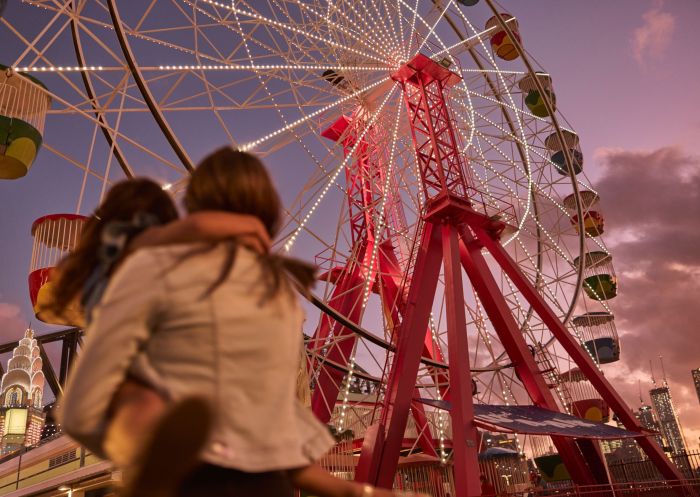 In front of the ferris wheel at Luna Park Sydney