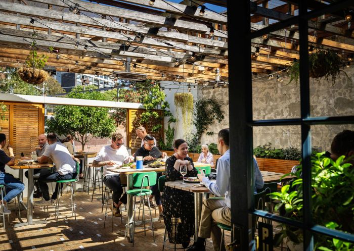 People eating at front courtyard at The White Cockatoo in Petersham