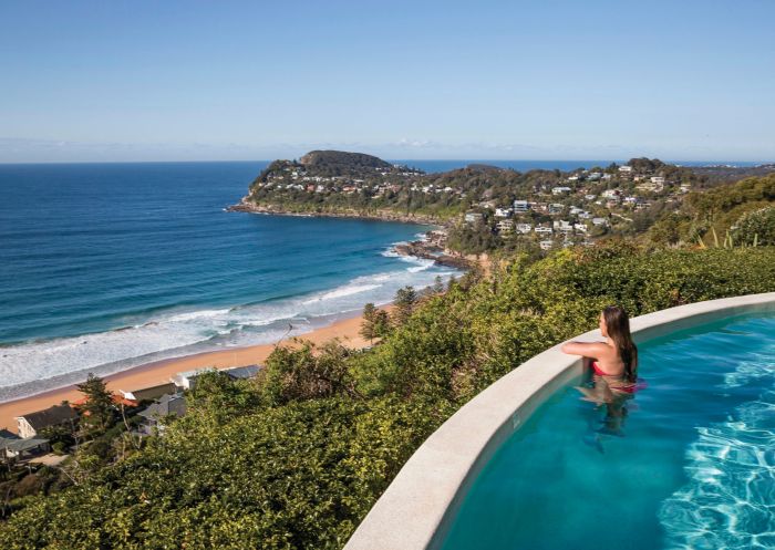 Woman enjoying ocean views from Jonah's on Whale Beach.