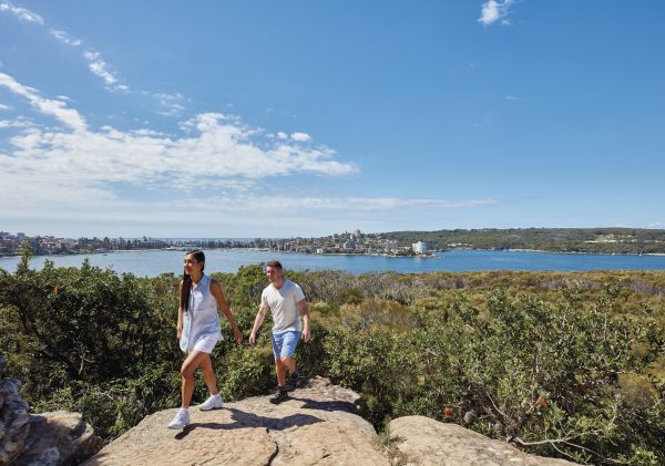 Couple enjoying stunning coastal views of Sydney Harbour from Dobroyd Head, Balgowlah Heights