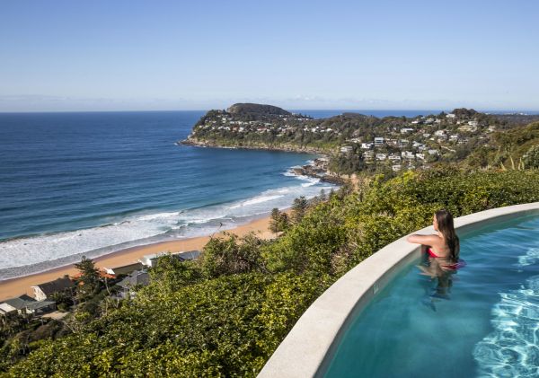 Woman enjoying ocean views from Jonah's on Whale Beach