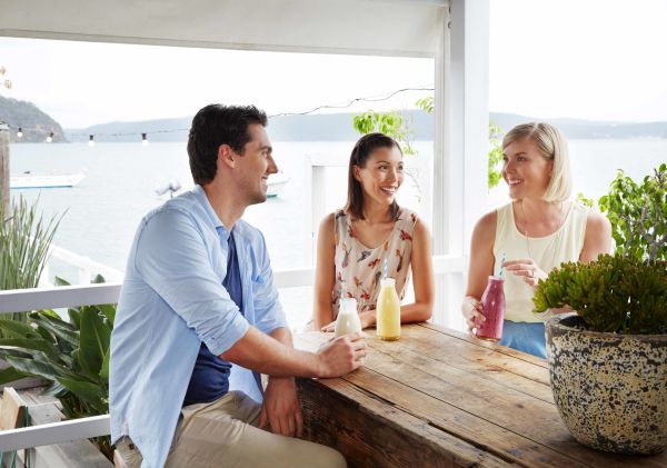 Friends enjoying breakfast smoothies at The Boathouse, Palm Beach