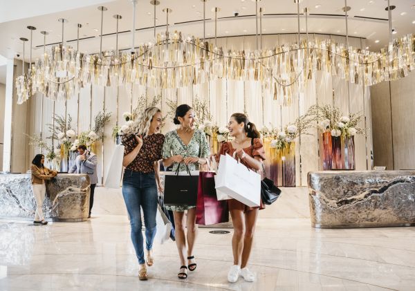 Friends returning to Crown Sydney after a day of shopping in Barangaroo, Sydney City