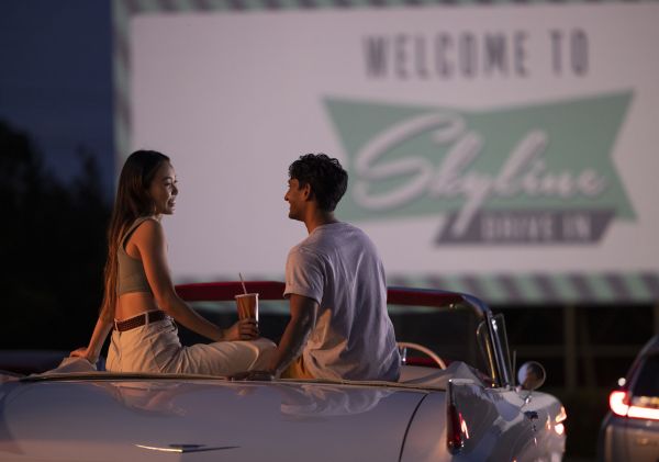 Couple sitting in their car ready to watch a movie at the Skyline Drive In Blacktown