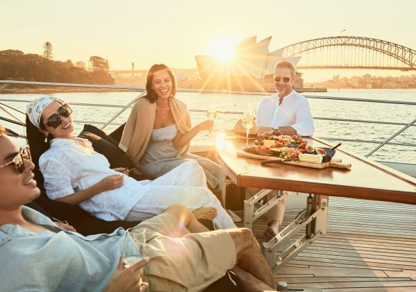 Friends dining on the Ghost 2 Super Yacht, Sydney Harbour