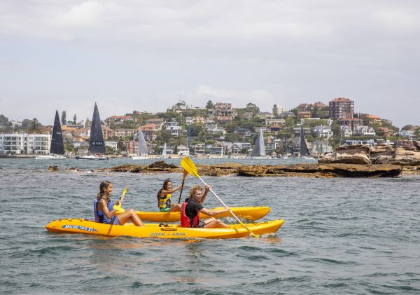 Friends enjoying kayaking, Sydney Harbour, Sydney