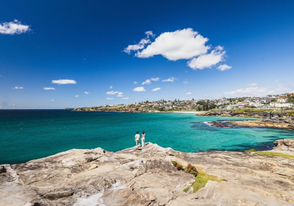 Couple overlooking coastal views from Tamarama to Coogee, Tamarama
