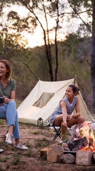 Children enjoying a campfire by their tent on the Hawkesbury River in Lower MacDonald