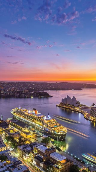 Aerial over Circular Quay and Sydney Icons at Sunrise