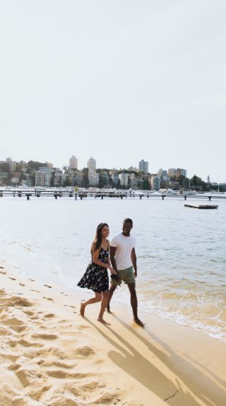 Couple enjoying a walk by Murray Rose Pool, Double Bay