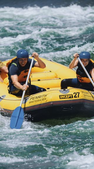 Couple enjoying a white water rafting experience at Penrith Whitewater Stadium in Sydney West