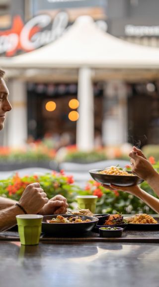 Couple enjoying food and drink at Thai La-Ong, Parramatta in Sydney's west