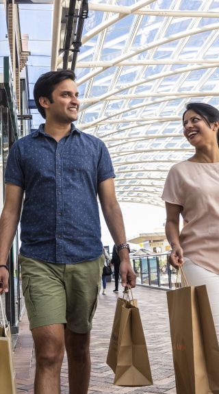 Couple enjoying a visit to Birkenhead Point Brand Outlet centre in the Inner Western Sydney suburb of Drummoyne, Inner Sydney