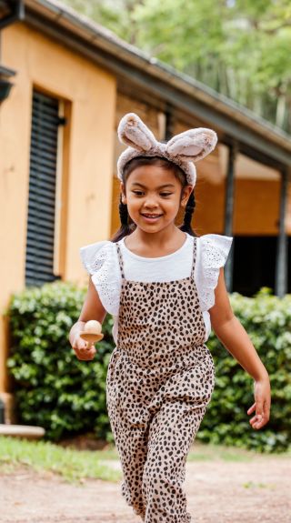 Two children playing egg and spoon race at Elizabeth Farm, Parramatta