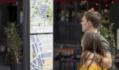 Couple reading information signs in Parramatta CBD, Western Sydney