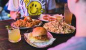 Couple enjoying friend chicken and drinks at Butter in Surry Hills