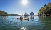 Friends kayaking on Pittwater at Bennets Wharf, Coasters Retreat