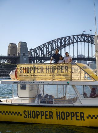 Family enjoying harbour views aboard the Shopper Hopper ferry service to Birkenhead Point Brand Outlet centre